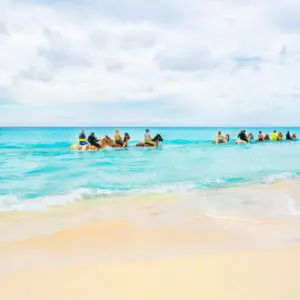 Why are the Turks and Caicos Islands ideal for horseback riding?