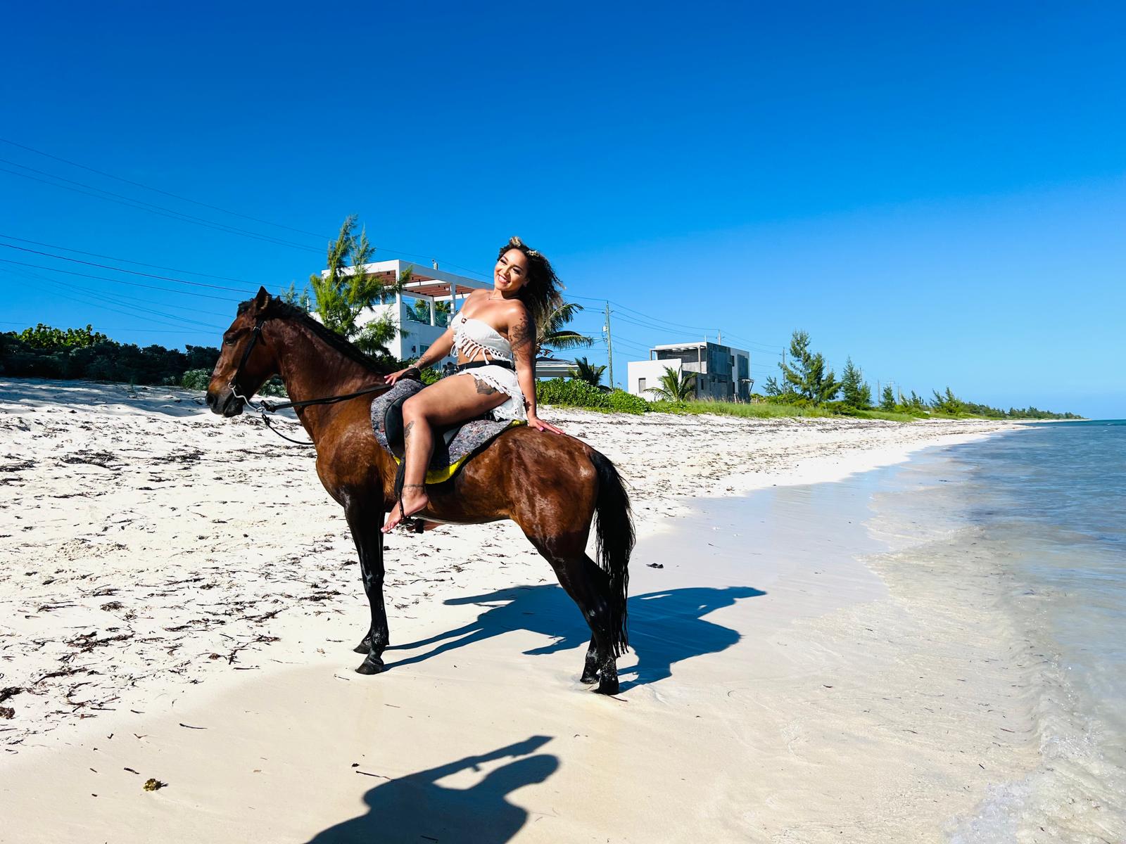 Happy horses on the beach in Turks and Caicos